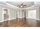 Spacious bedroom with hardwood floors, three doorways, and a closet with double doors at 505 Dimock Way, Wake Forest, NC 27587