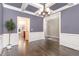 Elegant dining room with coffered ceilings, hardwood floors, and view to the living room at 505 Dimock Way, Wake Forest, NC 27587