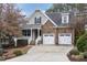 Charming two-story home features a stone facade, two-car garage, and well-manicured landscaping at 505 Dimock Way, Wake Forest, NC 27587