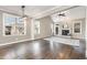 Bright living room featuring a fireplace, hardwood floors, a ceiling fan and windows at 505 Dimock Way, Wake Forest, NC 27587