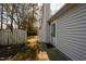 View of the side entrance, showcasing the door and adjacent fenced yard at 5108 Gable Ridge Dr, Durham, NC 27713