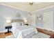 Comfortable bedroom with neutral tones, plush rug, and ample natural light at 5204 Winter Holly Ct, Raleigh, NC 27606