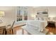 Well-lit bedroom features a large window with backyard views, soft white rug, and light neutral walls at 5204 Winter Holly Ct, Raleigh, NC 27606