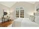 Bright bedroom with a large window providing backyard views and desk for a home office at 5204 Winter Holly Ct, Raleigh, NC 27606