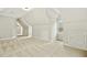 Spacious bonus room with dormer windows and neutral carpet at 5204 Winter Holly Ct, Raleigh, NC 27606