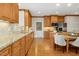 Updated kitchen with wood cabinets, granite counters, stainless steel appliances and hardwood floors at 5204 Winter Holly Ct, Raleigh, NC 27606