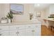 Convenient laundry room features ample counter space, storage cabinets and a utility sink at 5204 Winter Holly Ct, Raleigh, NC 27606