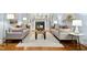 Well-lit living room featuring hardwood floors, fireplace, and comfortable seating at 5204 Winter Holly Ct, Raleigh, NC 27606