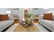 Cozy living room featuring hardwood floors, stylish furnishings, and a view of the front door at 5204 Winter Holly Ct, Raleigh, NC 27606