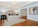 Stylish main bedroom showcasing a tray ceiling, plush rug, and double doors at 5204 Winter Holly Ct, Raleigh, NC 27606