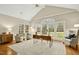 Bright and spacious office with large windows, vaulted ceiling, and stylish furniture at 5204 Winter Holly Ct, Raleigh, NC 27606