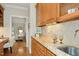 Attractive wet bar features custom cabinets, granite countertops, and a sink near living room at 5204 Winter Holly Ct, Raleigh, NC 27606