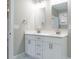 Bathroom featuring double vanity, white cabinets, framed mirrors, and modern fixtures at 531 Perth Rd, Sanford, NC 27332