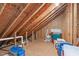 Unfinished attic space with exposed beams, perfect for storage or future expansion at 5512 Spring Bluffs Ln, Raleigh, NC 27606