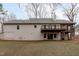 Rear exterior of the home with a deck, screened porch, and sliding glass doors to the backyard at 5512 Spring Bluffs Ln, Raleigh, NC 27606