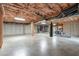 Unfinished basement featuring concrete flooring, exposed insulation, and exercise equipment, ideal for customization at 5512 Spring Bluffs Ln, Raleigh, NC 27606