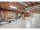 Spacious unfinished basement with workout equipment, concrete flooring, and exposed ceiling for easy customization at 5512 Spring Bluffs Ln, Raleigh, NC 27606