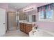 Relaxing bathroom with soaking tub, glass enclosed shower, double sink vanity, and natural light at 5512 Spring Bluffs Ln, Raleigh, NC 27606