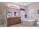 Elegant bathroom featuring a soaking tub, double vanities, and a separate glass shower at 5512 Spring Bluffs Ln, Raleigh, NC 27606