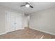 Spacious bedroom with modern ceiling fan, closet, and new floors at 5512 Spring Bluffs Ln, Raleigh, NC 27606
