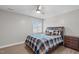 Comfortable bedroom with a ceiling fan, natural light, and a well-coordinated bedroom set at 5512 Spring Bluffs Ln, Raleigh, NC 27606