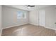 Inviting bedroom with a large window providing natural light and neutral paint throughout at 5512 Spring Bluffs Ln, Raleigh, NC 27606