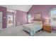 Cozy bedroom with vaulted ceilings, a comfortable bed, and natural light coming through the windows at 5512 Spring Bluffs Ln, Raleigh, NC 27606