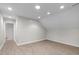 Spacious bonus room with recessed lighting and wood-look floors, ready for personalization at 5512 Spring Bluffs Ln, Raleigh, NC 27606