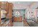 Spacious kitchen with modern appliances and views into the dining room at 5512 Spring Bluffs Ln, Raleigh, NC 27606
