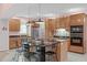 Well-appointed kitchen features granite countertops, stainless steel appliances, and a central island at 5512 Spring Bluffs Ln, Raleigh, NC 27606