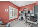 Bright home office with built-in shelving, a window, and comfortable seating at 5512 Spring Bluffs Ln, Raleigh, NC 27606