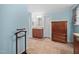 Spacious bathroom with a wooden vanity, shower, and decorative wooden dresser at 6001 Rock Bottom Rd, Oxford, NC 27565