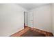 Bedroom with hardwood flooring, white walls, and ample lighting at 6001 Rock Bottom Rd, Oxford, NC 27565