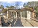 Back deck view of home with multiple glass sliding doors for indoor/outdoor living at 6065 Merion Cir, Sanford, NC 27332