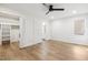 Bright bedroom features light wood floors, neutral walls, closet, and access to ensuite bath at 6065 Merion Cir, Sanford, NC 27332