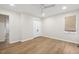 Bedroom featuring wood floors, white walls, closet and window with shade at 6065 Merion Cir, Sanford, NC 27332
