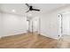 Bright bedroom features light wood floors, neutral walls, and multiple closets at 6065 Merion Cir, Sanford, NC 27332