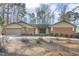 Charming single-story brick home with well-maintained landscaping and a spacious driveway at 6065 Merion Cir, Sanford, NC 27332
