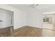 Bright room featuring hardwood floors, white walls, and a view into the sunroom at 6065 Merion Cir, Sanford, NC 27332