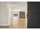 Inviting living room showcasing a brick fireplace, hardwood floors, and abundant natural light at 6065 Merion Cir, Sanford, NC 27332