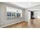 Inviting living room with a large window overlooking the backyard and an open view into the living room with a fireplace at 6065 Merion Cir, Sanford, NC 27332