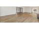 Airy living space with hardwood floors, a fireplace, and access to other rooms at 6065 Merion Cir, Sanford, NC 27332