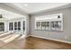 Cozy living room featuring lots of natural light and access to the sunroom and outdoor deck at 6065 Merion Cir, Sanford, NC 27332