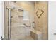 Walk-in shower features neutral tile, built-in niche, and grab bars at 6065 Merion Cir, Sanford, NC 27332