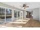 Bright sun room featuring a ceiling fan and sliding glass doors to the outside deck at 6065 Merion Cir, Sanford, NC 27332