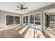 Spacious sun room features a ceiling fan and sliding glass doors to the outside deck at 6065 Merion Cir, Sanford, NC 27332