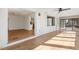 Spacious sun room features white brick accent wall and sliding glass door to the outside at 6065 Merion Cir, Sanford, NC 27332