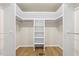Spacious walk-in closet has custom storage and light wood flooring at 6065 Merion Cir, Sanford, NC 27332