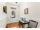 Bright foyer featuring hardwood floors, a small table and wreath at 622 Sunset Ave, Apex, NC 27502