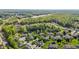 A picturesque aerial view of a planned community surrounded by lush forests and a tranquil lake at 638 Village Lake Dr, Mebane, NC 27302